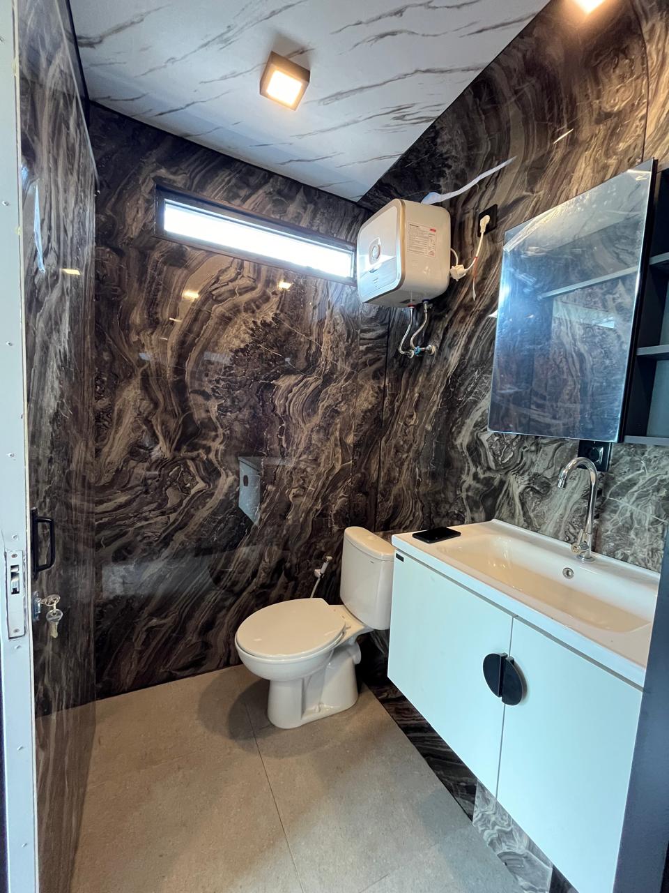 Caseea interior — dark marble bathroom
